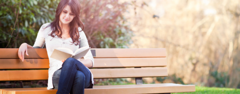 Photo of a young woman reading